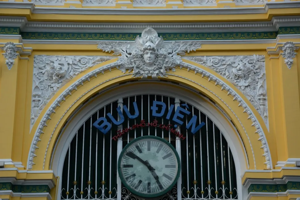 white and gold analog clock